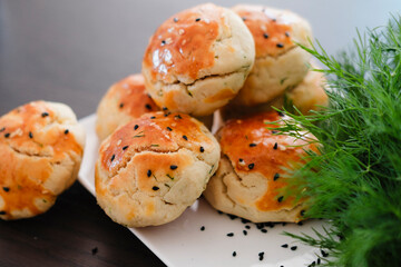 turkish savory pastry pogaca with dill and black sesame or cumin, homemade quick snack