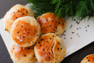 turkish savory pastry pogaca with dill and black sesame or cumin, homemade quick snack