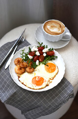 Tasty Fried Egg Served on a White Plate with Salad and Shrimps Cup with Cappuccino Healthy Breakfast