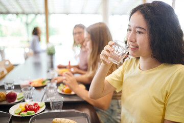 Students enjoying lunch in a bright and friendly school cafeteria