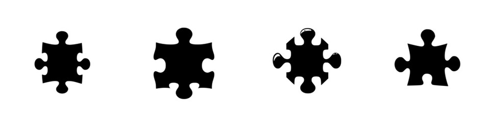 Obraz premium Puzzle pieces of varying sizes displayed in a row on a white background for design and creativity themes