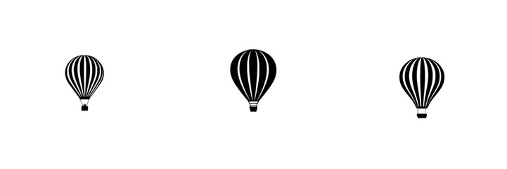 Fototapeta premium Hot air balloons in a clear sky drifting gently during sunrise over an open field