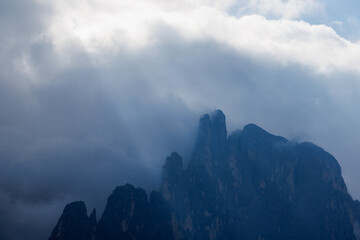 The mountains shrouded in clouds seen from San Martino di Castrozza - Italy