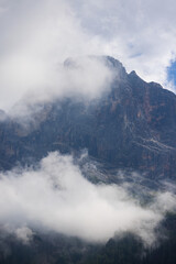 The mountains shrouded in clouds seen from San Martino di Castrozza - Italy