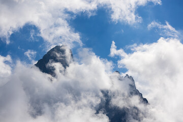 The mountains shrouded in clouds seen from San Martino di Castrozza - Italy