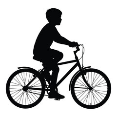 Obraz premium Silhouette of a young boy riding a bicycle outdoors capturing the joy of childhood movement silhouette