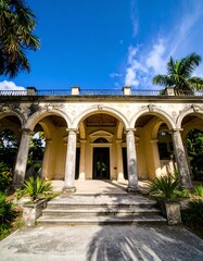 Grand mansion entrance under a clear sky