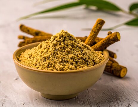 Ceramic Bowl of Vasambu Powder with Ayurvedic Root Sticks