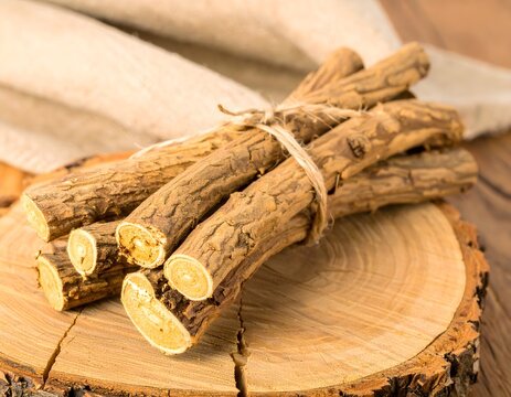 Bundle of Dried Vasambu Root Sticks on Wooden Board