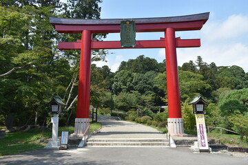 Red Torii Gate at Shrine Entrance in Japan