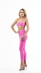 Obraz premium Fitness model posing in pink sportswear on white background