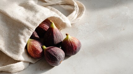 Fresh figs in a cotton bag on stone surface ,National Fig Week