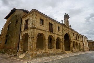 Fototapeta premium Arched side entrance of Santa Maria Church in Fuentes de Navas, Palencia