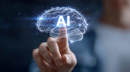 Hand interacting with holographic brain displaying AI, symbolizing technology and innovation. image conveys sense of futuristic advancement and digital interaction