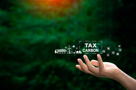 Investing in the carbon tax. income tax system icon around. futuristic virtual screen interface technology. financial investment stock market.