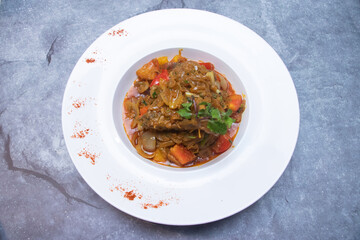 Chicken Dopeyaza Garnished with Fresh Cilantro in plate top view of Spicy Indian Chicken Curry with onion