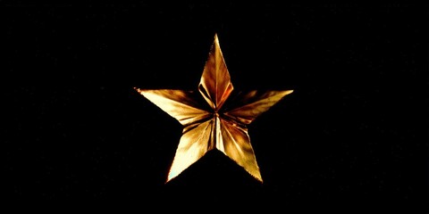 Obraz premium A captivating golden star shines brilliantly against a deep black backdrop, creating a powerful image.