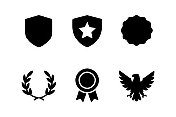 Fototapeta premium Black silhouette icons: shields, badges, and laurel for achievement design