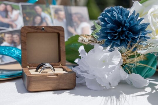 Wedding rings with flowers and photos.