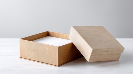 Open Gold Cardboard Gift Box on White Marble Surface