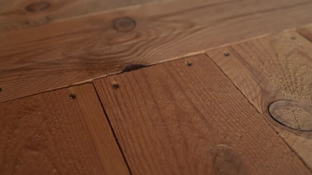 wooden beams and wooden floor construction in interior, texture of untreated wood. Concept of architecture, construction, repair work