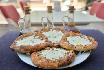 Turkish pide with pieces of cheddar 

