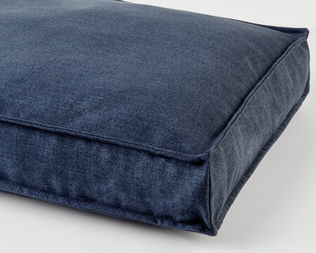 Comfortable washable denim dog bed providing relaxing spot for canine friend