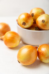 Onion on the kitchen table. onion slice. onion rings. Fresh Yellow Onion. Natural, fresh, vegetarian food. Agricultural products. Healthy eating. Vegetables. Farmer's market. Space for text.Copy space
