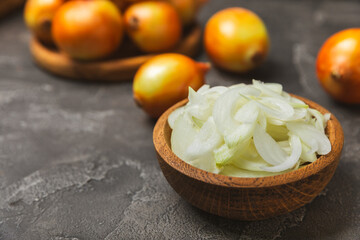 Onion on the kitchen table. onion slice. onion rings. Fresh Yellow Onion. Natural, fresh, vegetarian food. Agricultural products. Healthy eating. Vegetables. Farmer's market. Space for text.Copy space