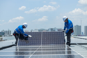 Technicians installing solar panel on city rooftop © Washburn