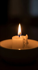 Cozy hygge candle flame still life warm glow evening ambiance relaxation comfort 