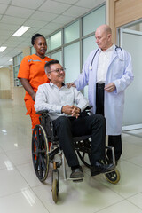 Fototapeta premium Doctor and nurse supporting happy recovering patient