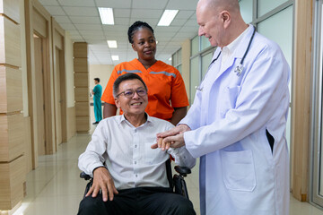 Doctor and nurse supporting happy recovering patient