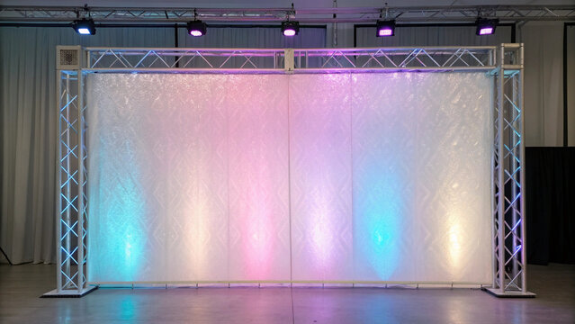 Stage lighting truss with translucent screen illuminated by colorful stage lights structure