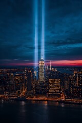 Aerial view of New York City skyline at night with twin beams of light tribute in remembrance of September 11 attacks