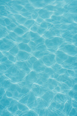 Obraz premium Clear blue water surface with gentle ripples swimming pool