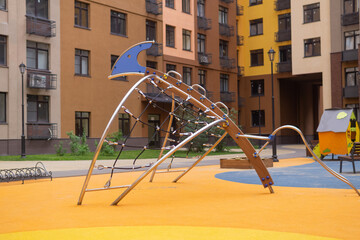 Fototapeta premium Children's playground in the courtyard of of a residential building