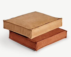 Two square floor cushions stacked on white background, showing comfort and style
