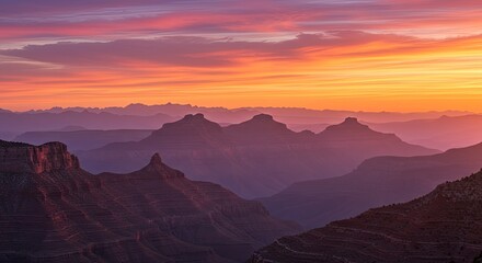 Grand Canyon Sunset: Majestic Layers of Mountains, Vibrant Sky, Serene Landscape.