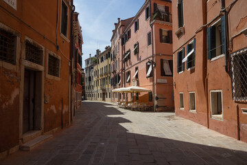 Empty street with old residential building in Venice, Italy (no water)