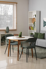 Stylish living room with soft sofa, table and shelving unit