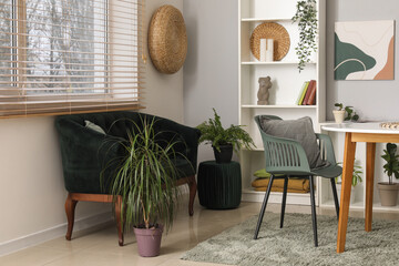 Modern living room with black sofa, table and shelving unit