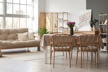 Interior of room with dining table and sofa