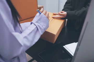 Portrait of Starting small businesses SME owners, two Asian woman check online orders Selling products working with boxs freelance work at home office, sme business online small medium enterprise