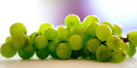 A bunch of fresh, ripe green grapes, perfect for a healthy snack.