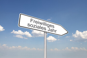 Richtungspfeil mit der Aufschrift FREIWILLIGES SOZIALES JAHR vor blauem Himmel