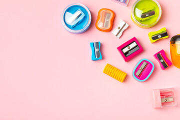 Pencil sharpener on bright colored background. Pencil and pencil shavings. Stationery. School supplies. School products. Flat lay. Place for text. copy space.