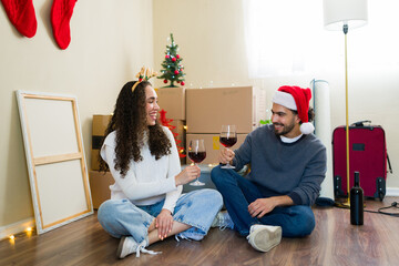 Smiling couple celebrating first christmas in new home