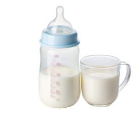 Glass mug and baby feeding bottle filled with healthy nutritious milk supplement for infants
