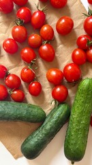 Juicy cherry tomatoes and fresh cucumbers, perfect for a summer salad. Natural ingredients for delicious and healthy cooking.